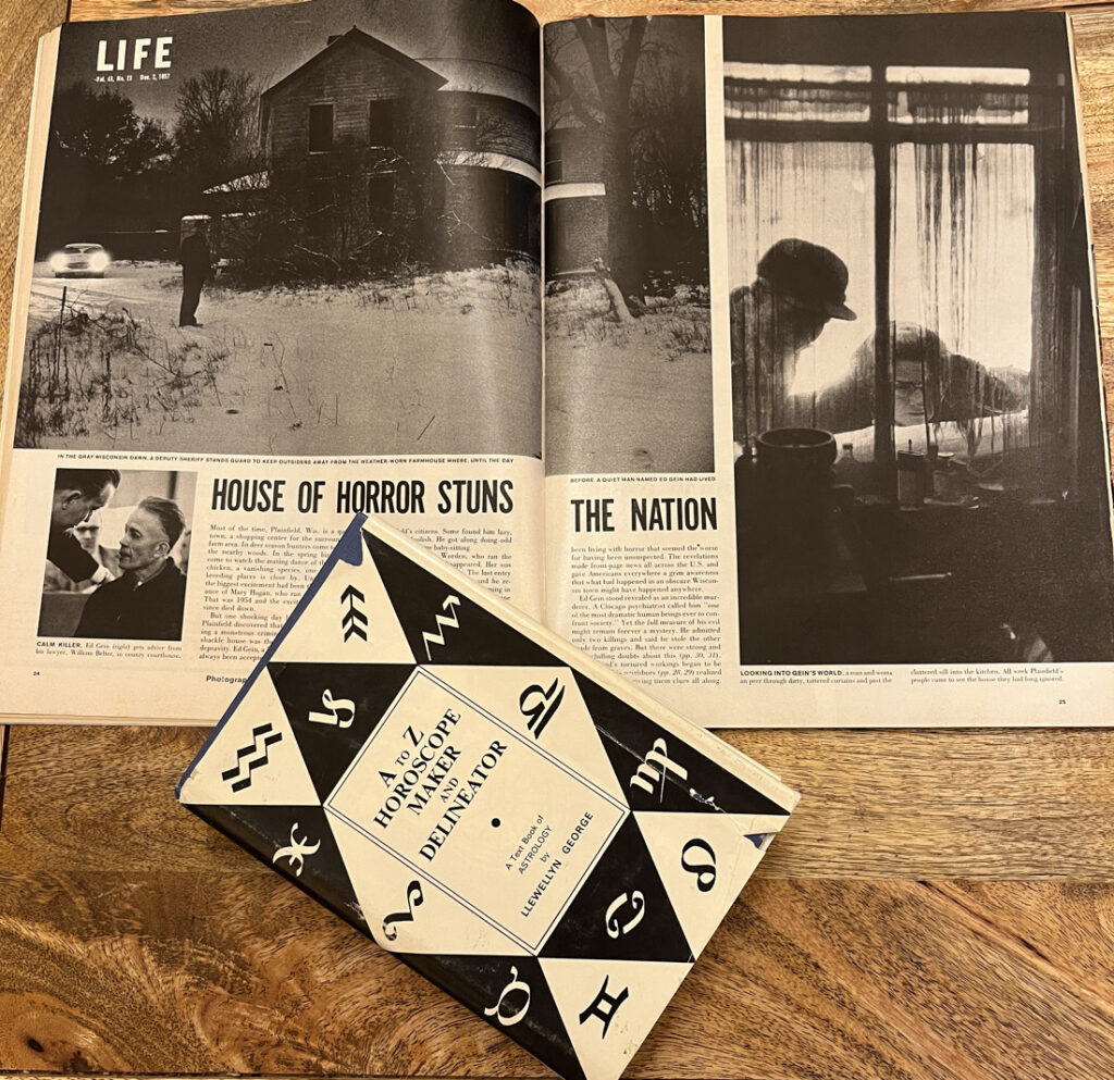 Life Magazine, December 2, 1957, opened to spread about Ed Gein. Atop it is the book A to Z Horoscope Maker and Delineator by Llewellyn George.